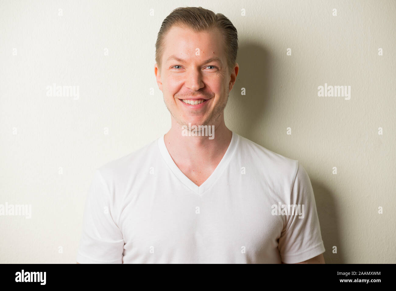 Face of happy young handsome man with blond hair smiling Stock Photo ...