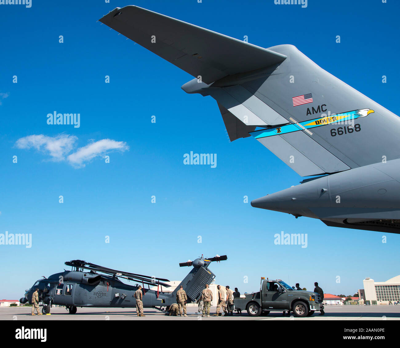 U.S. Air Force Airmen upload an HH-60 Pave Hawk helicopter assigned to the 305th Rescue Squadron (RQS), Davis-Monthan Air Force Base, Ariz., onto a C-17 Globemaster III assigned to the 436th Airlift Wing (AW), Dover Air Force Base, Dela., at MacDill Air Force Base, Fla., Nov. 20, 2019. The 436th AW supported the departure of the 305th RQS following a Joint Force deployment exercise. (U.S. Air Force photo by Airman 1st Class Ryan C. Grossklag) Stock Photo