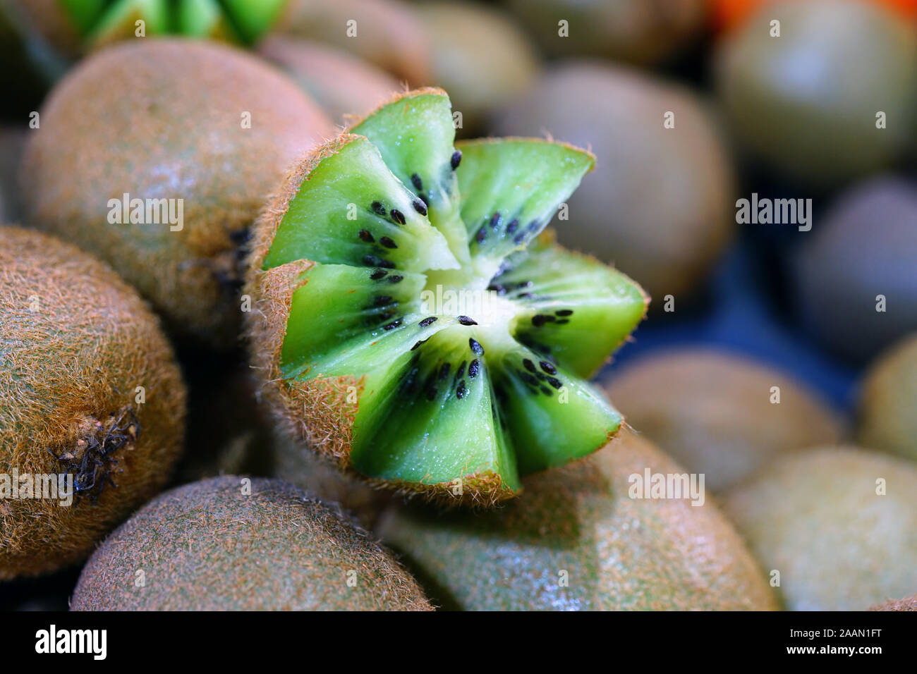 Kiwi fruit cut in half with zigzag edges Stock Photo Alamy