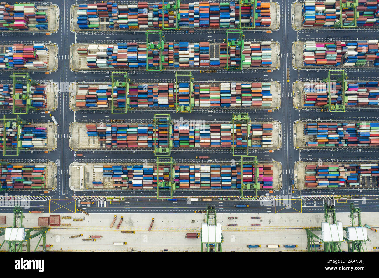 View from above, stunning aerial view of the port of Singapore with thousands of colored containers ready to be loading on the cargo ships. Stock Photo