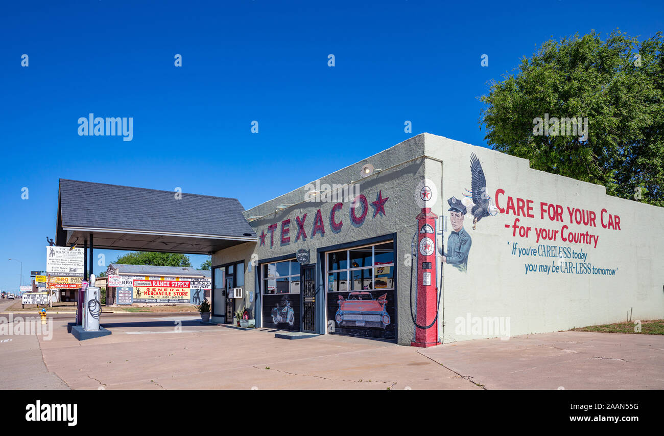 New Mexico, USA. May 14, 2019. Old-fashioned gas station next to historic route 66. Building with a smart logo on the wall background, as advertisemen Stock Photo