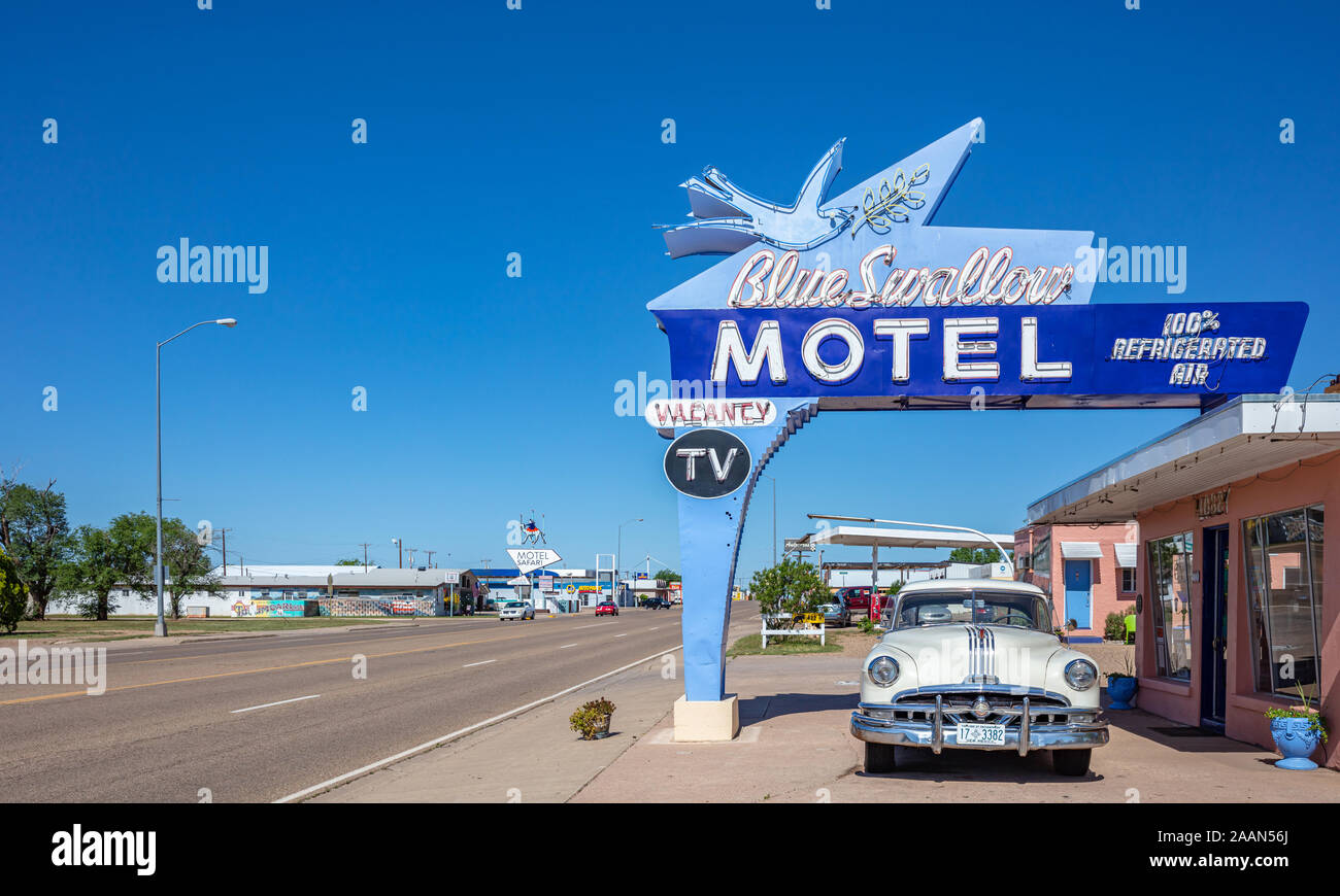 Tucumcari, New Mexico, USA. May 14, 2019. Motel Blue Swallow next to mother road, route 66, a sunny day. An antique pontiac car is parked at the entra Stock Photo