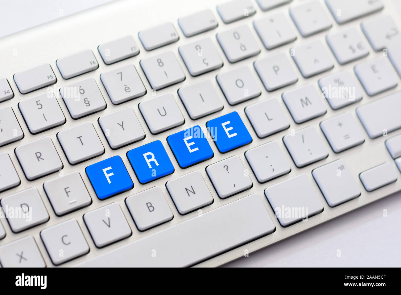 Free Keybor FREE writing on white keyboard Stock Photo - Alamy