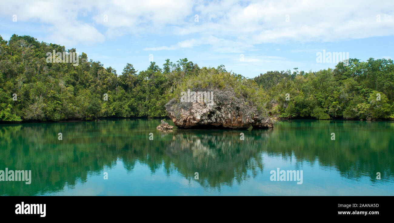 Limestone coastal scenic in Hidden Bay, Gam Island, Raja Ampat, West Papua Indonesia Stock Photo