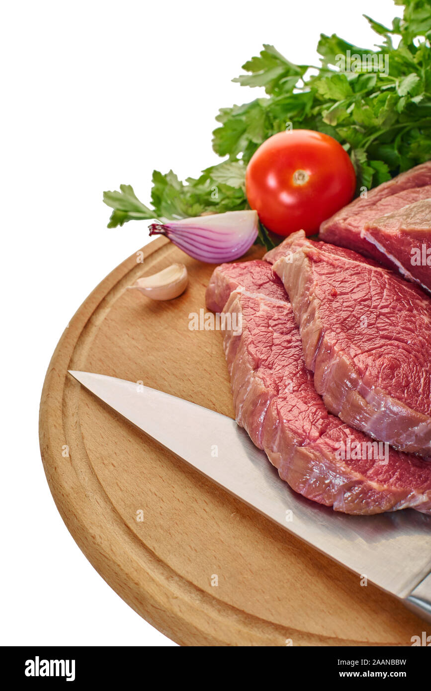 https://c8.alamy.com/comp/2AANBBW/raw-meat-with-vegetables-and-knife-on-the-board-2AANBBW.jpg