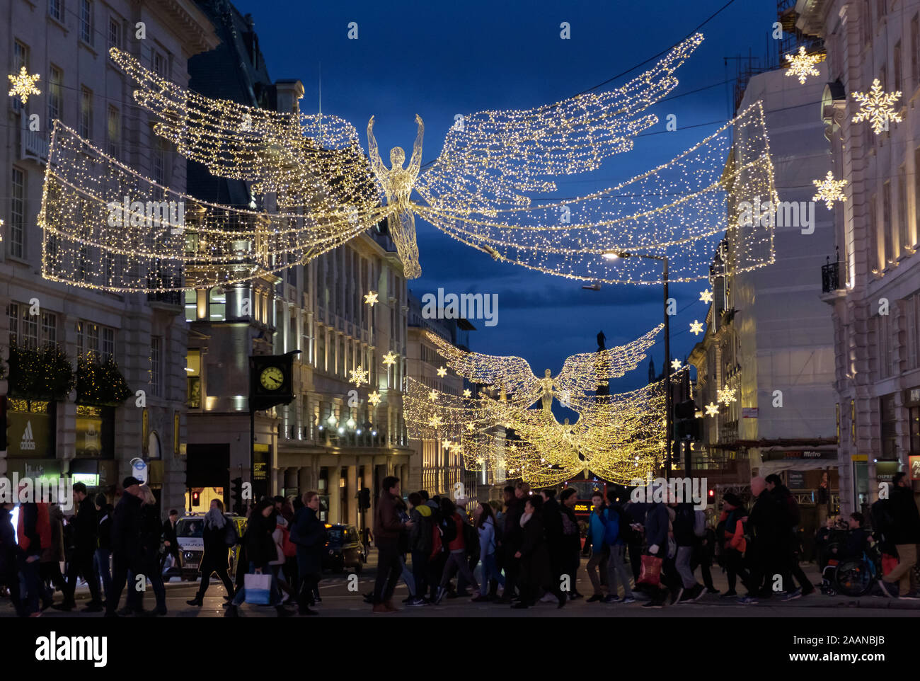 Angel Christmas Lights decorate Piccadilly Circus while shopping