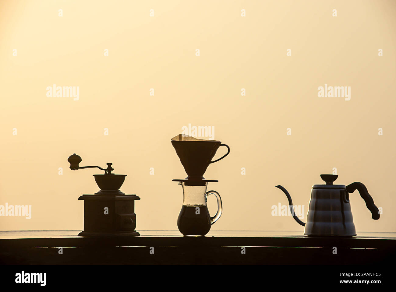 Wooden Coffee Grinder , Glass jars and kettles on a wooden table