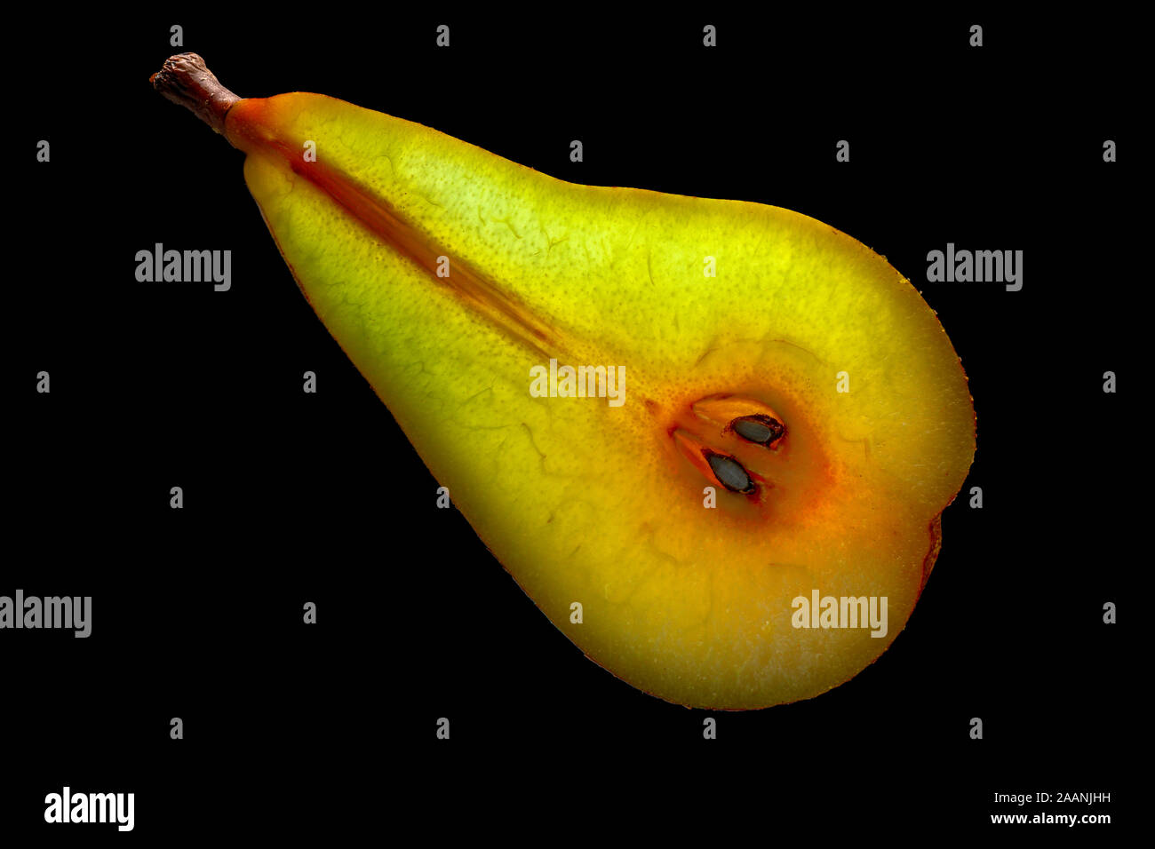 Slice of Pear with Backlight Isolated on Black Background Stock Photo