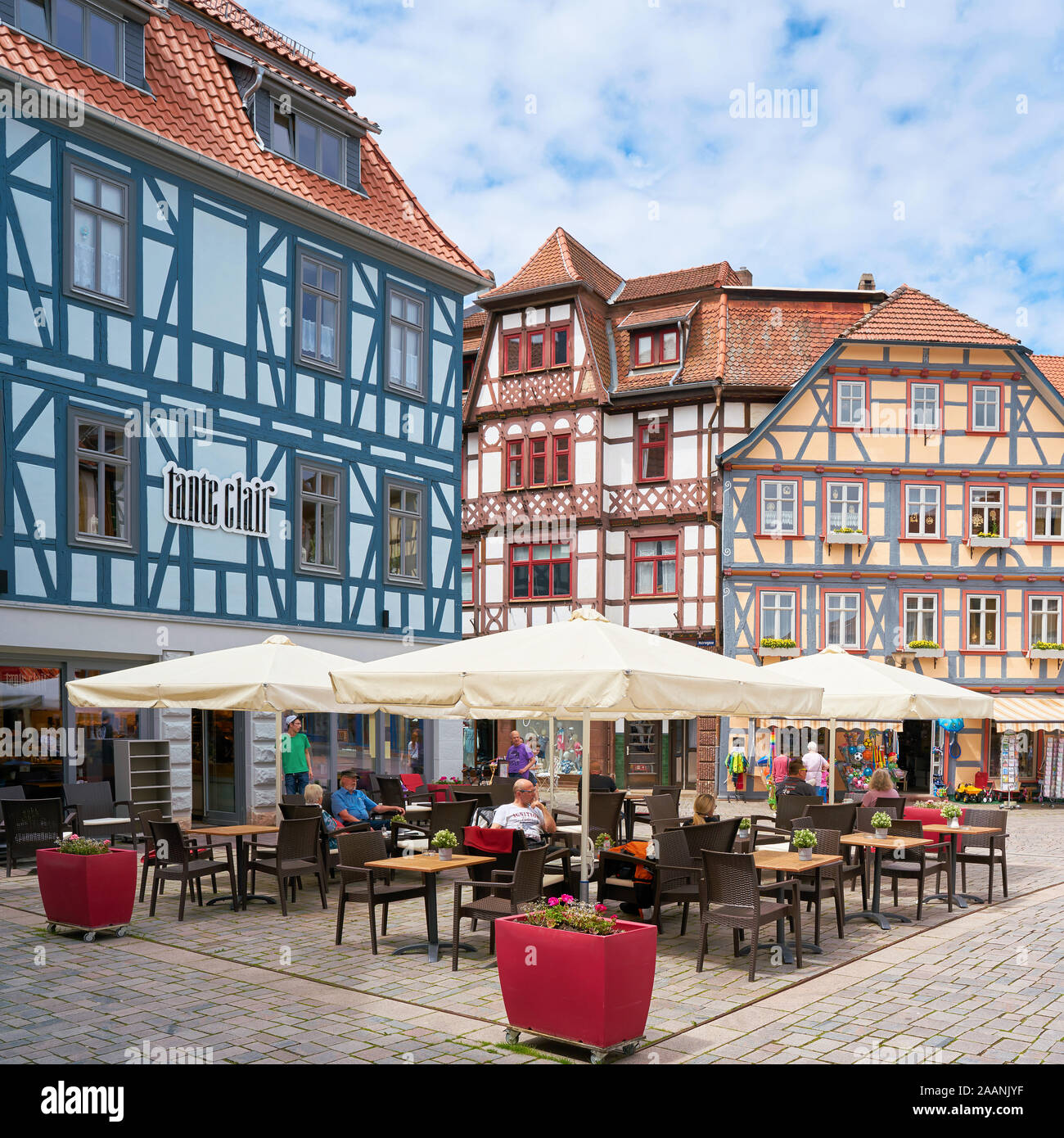 Tourists at a cafe in the historic old town of Schmalkalden in Thuringia Stock Photo