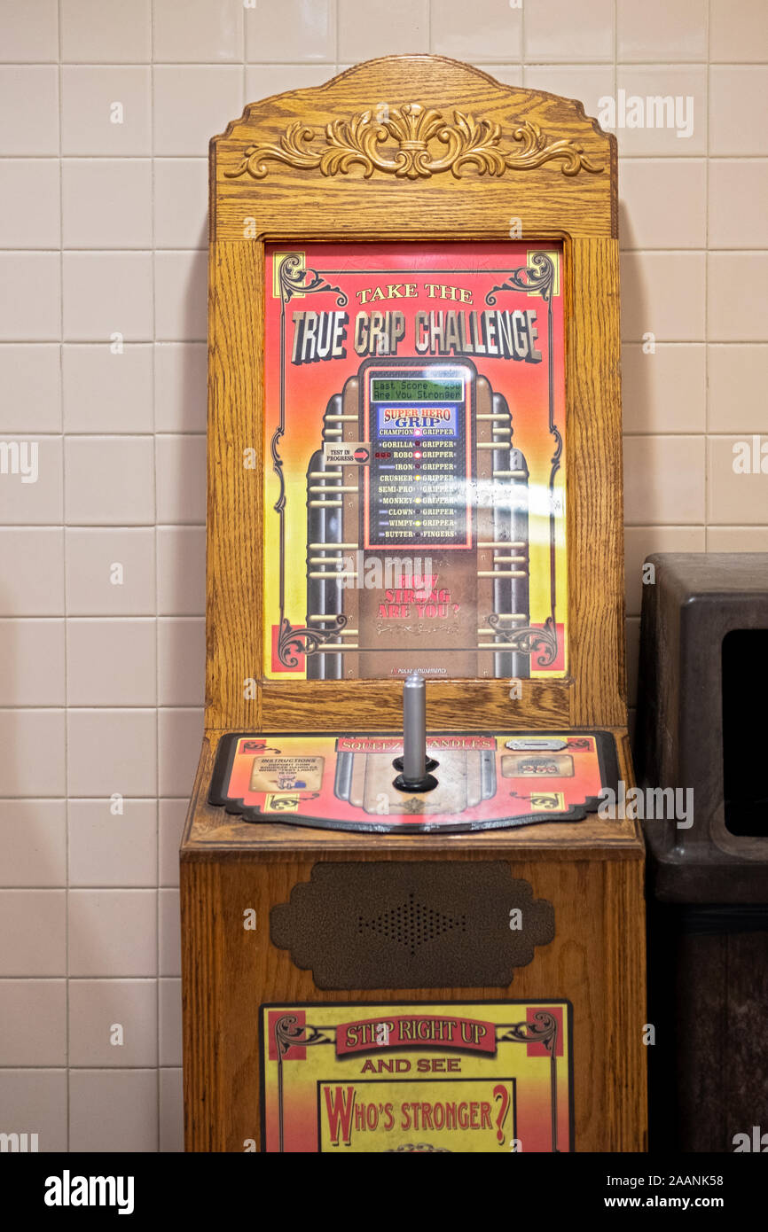 TRUE GRIP CHALLENGE. A machine in the men's room of the Ramapo, New Jersey rest stop on the New York Thruway in Sloatsburg, New York. Stock Photo