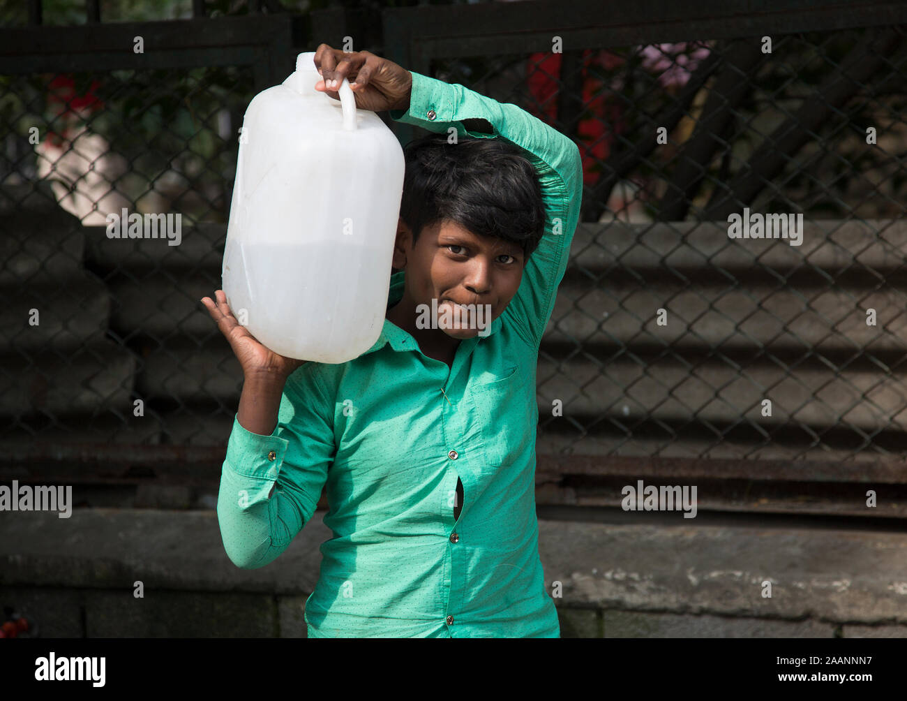 (191123) -- NEW DELHI, Nov. 23, 2019 (Xinhua) -- A boy carries a drinking water container in New Delhi, India, Nov. 23, 2019. Days after India's federal government rankings on tap water showed samples taken from the capital city Delhi have failed on all parameters, the local authorities Wednesday said it would collect over 3,000 fresh samples from across the city for quality check. The federal government's consumer affairs ministry last week said 11 drinking water samples drawn from various places in Delhi did not comply with the requirements of the Bureau of Indian Standard and failed on se Stock Photo