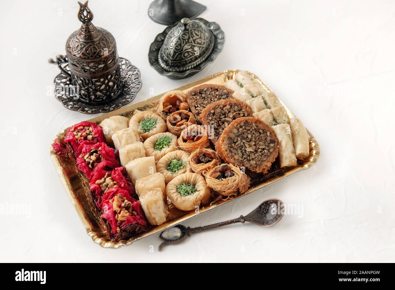 Eid Mubarak with Arabic sweets. Dried dates and tea in Arabic glasses ...