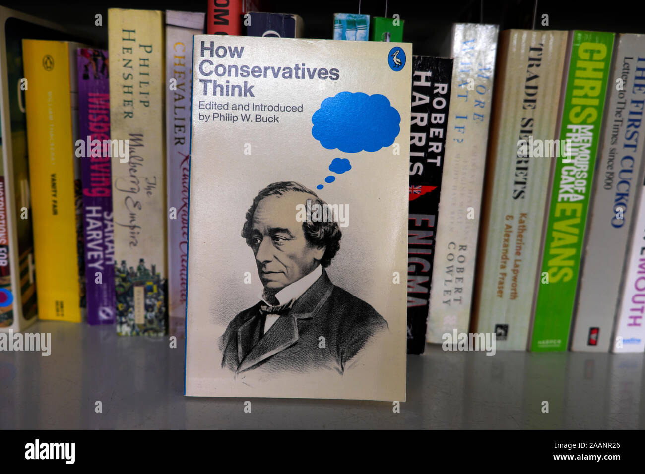 'How Conservatives Think'  book cover on a book shelf in a second hand bookshop charity shop London England UK  KATHY DEWITT Stock Photo