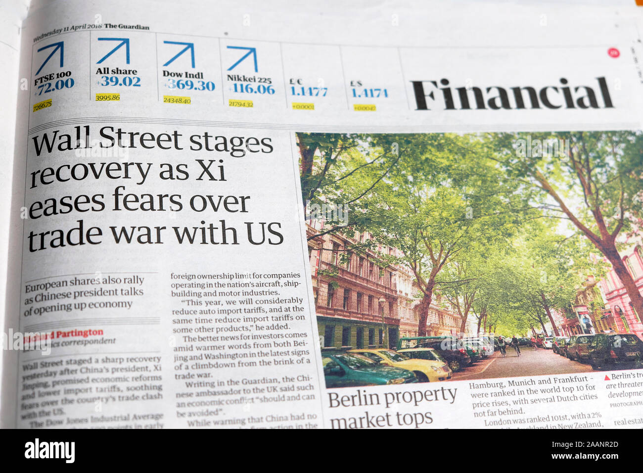 'Wall Street stages recovery as Xi eases fears over trade war with US' newspaper article in Guardian financial section 11 April 2018 London UK Stock Photo