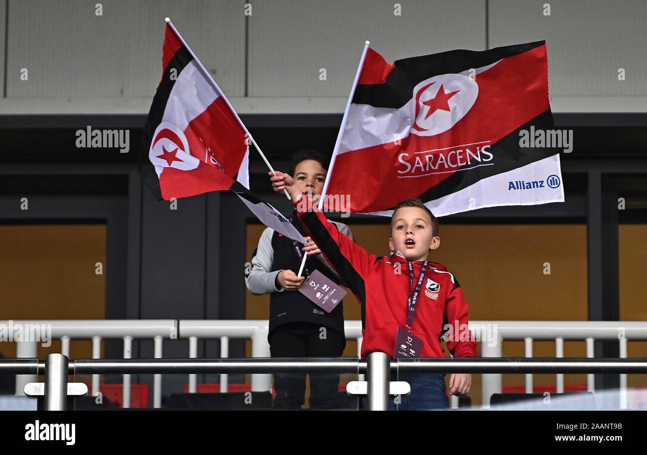 Hendon. United Kingdom. 23 November 2019. Young fans wave flags before the game. Saracens v Ospreys. Pool 4. Heineken Champions Cup. Second (2nd) round. Allianz Park. Hendon. London. UK. Credit Garry Bowden/Sport in Pictures/Alamy Live News. Stock Photo