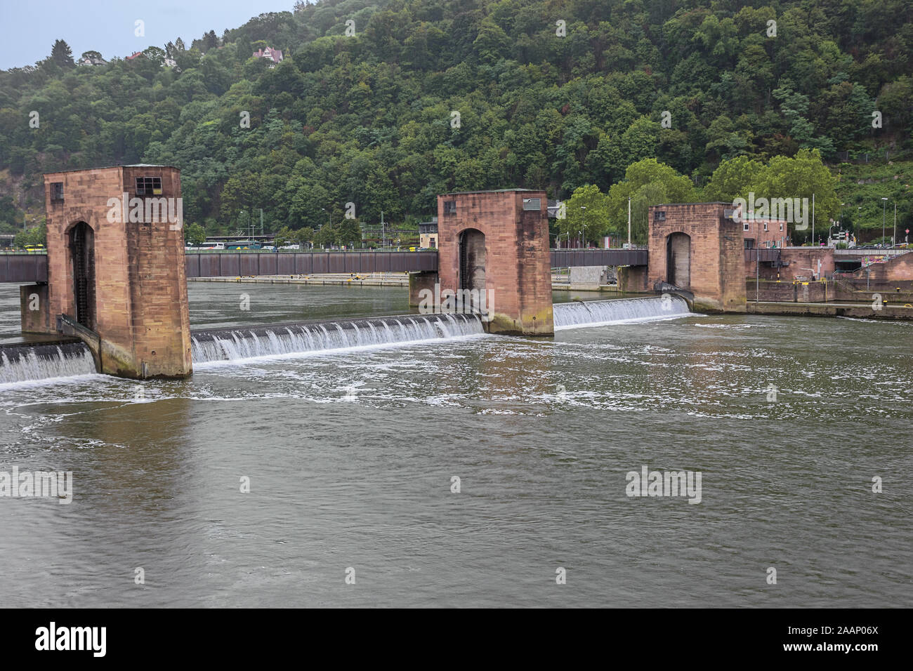 The weir over the Neckar in Heidelberg seen from the right bank of the river Stock Photo