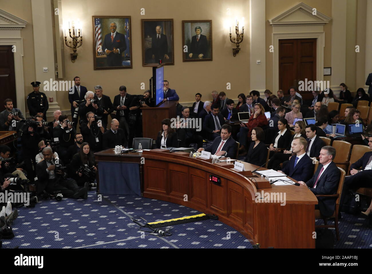 Washington, District of Columbia, USA. 21st Nov, 2019. Former White House national security aide Fiona Hill, and David Holmes, a U.S. diplomat in Ukraine, seated right, listen to opening statements before testifying before the House Intelligence Committee on Capitol Hill in Washington, Thursday, Nov. 21, 2019, during a public impeachment hearing of President Donald Trump's efforts to tie U.S. aid for Ukraine to investigations of his political opponents Credit: Alex Brandon/CNP/ZUMA Wire/Alamy Live News Stock Photo