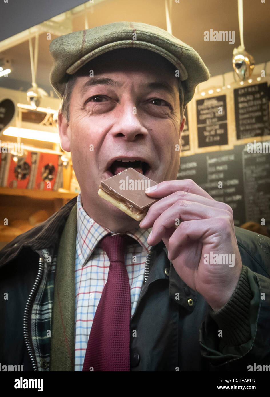 Brexit Party leader Nigel Farage eats a millionaire shortbread in the Market Hall at Middleton Grange Shopping Centre whilst on the General Election campaign trail in Hartlepool, County Durham. Stock Photo