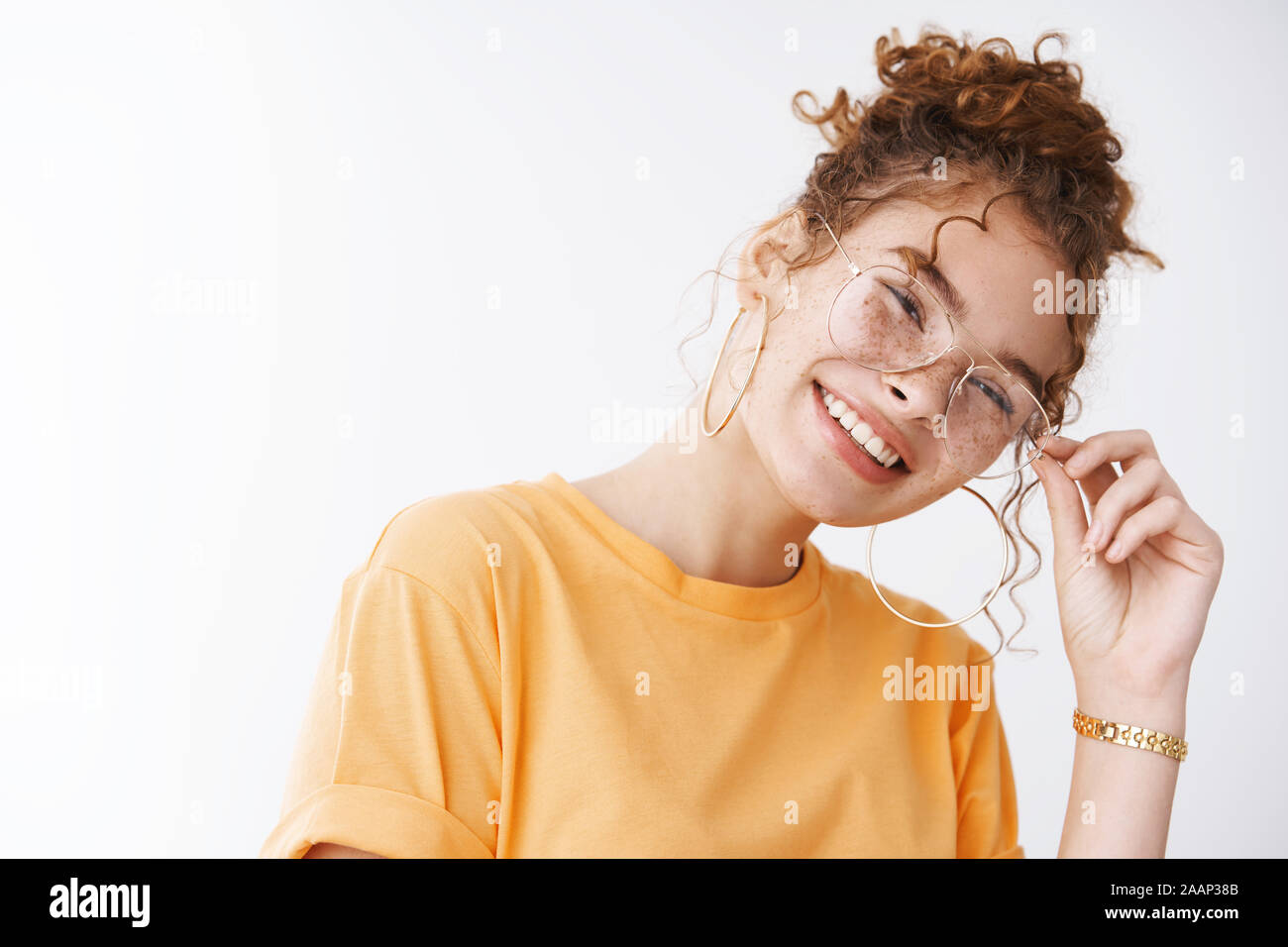 Charismatic friendly outgoing caucasian redhead teenage girl having fun  friends laughing fool around playful attitude tilting head checking glasses  Stock Photo - Alamy, image size:1300x956