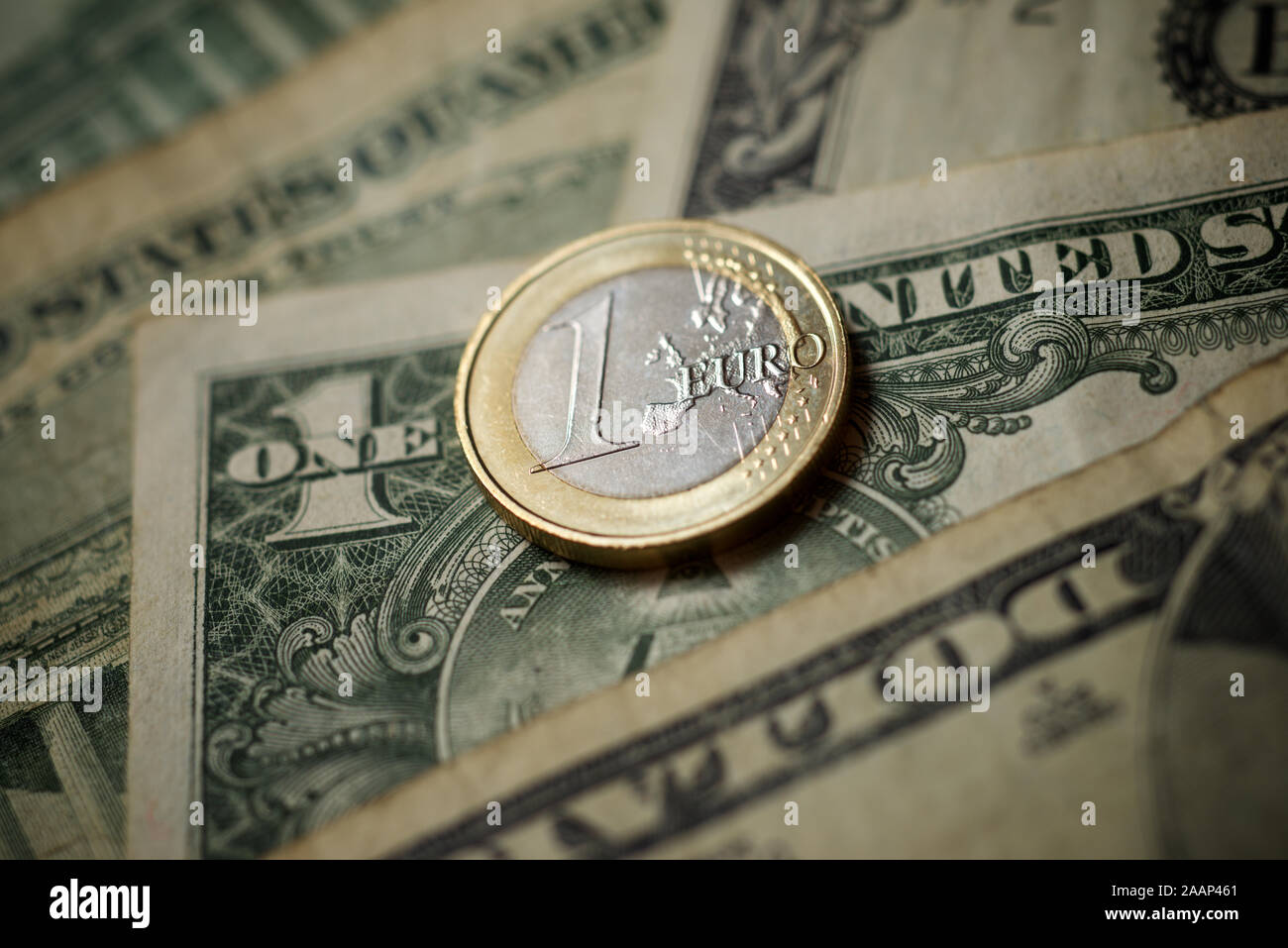 One Euro Coin And Dollars Banknotes Stock Photo Alamy