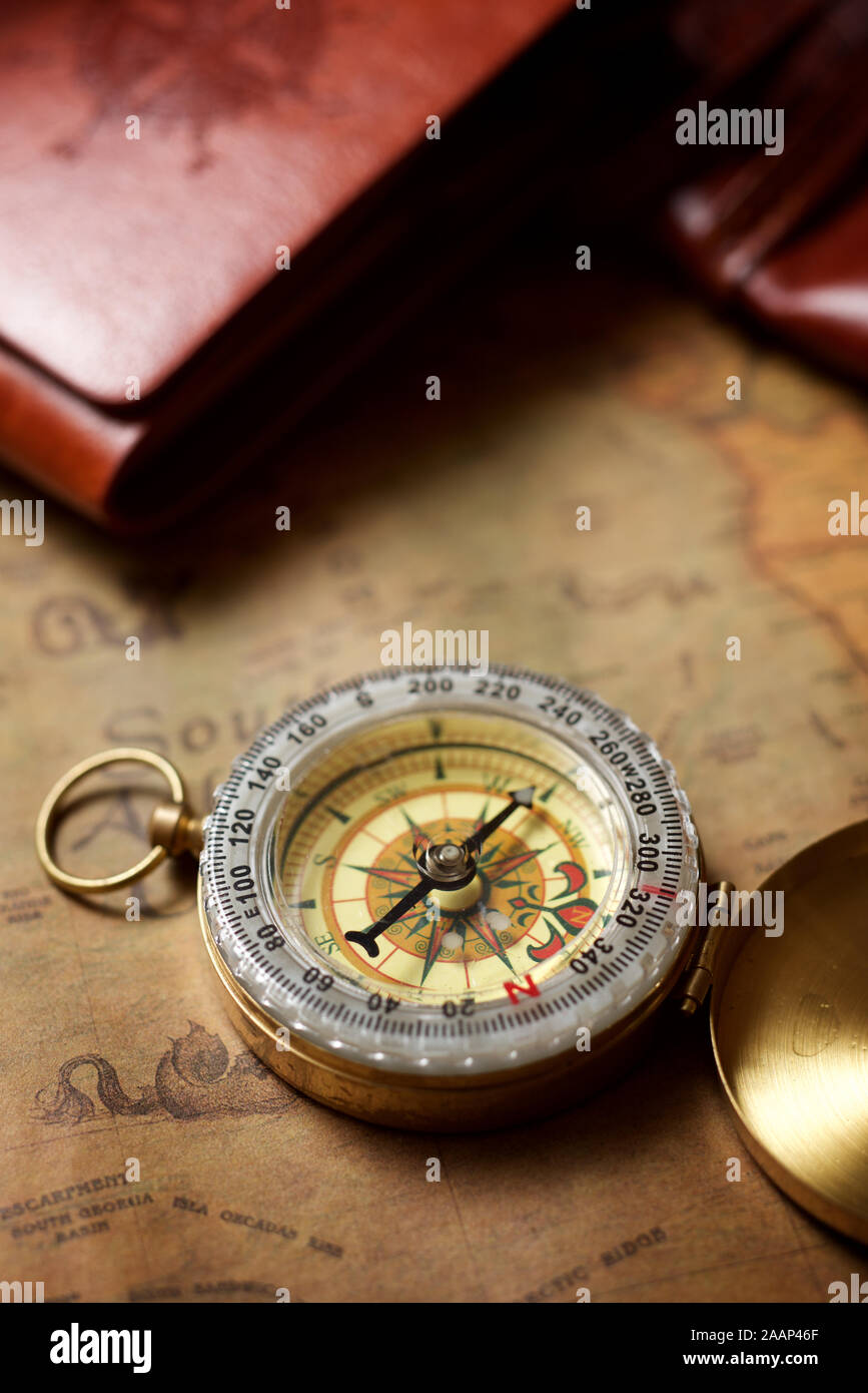 Vintage compass and old navigation map Stock Photo - Alamy