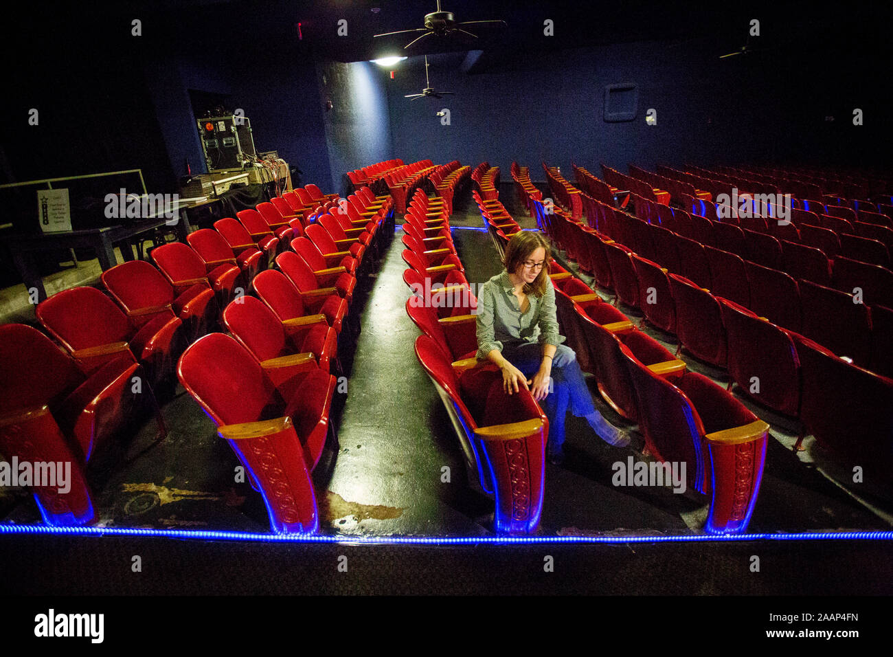 Mary Katherine McElroy in the seat where Oswald sat when he was arrested. Suspected JFK assassin Lee Harvey Oswald was arrested in the Texas Theatre after having shot and killed US President John F. Kennedy and later Dallas Police Officer J. D. Tippit. Lee Harvey Oswald was seated in the second seat from the right on the third last row. Stock Photo