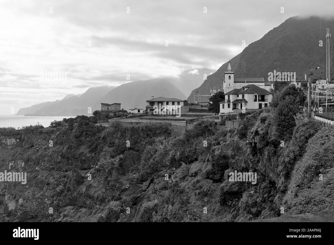 A village with white buildings on a cliff in the Atlantic Ocean (Seixal