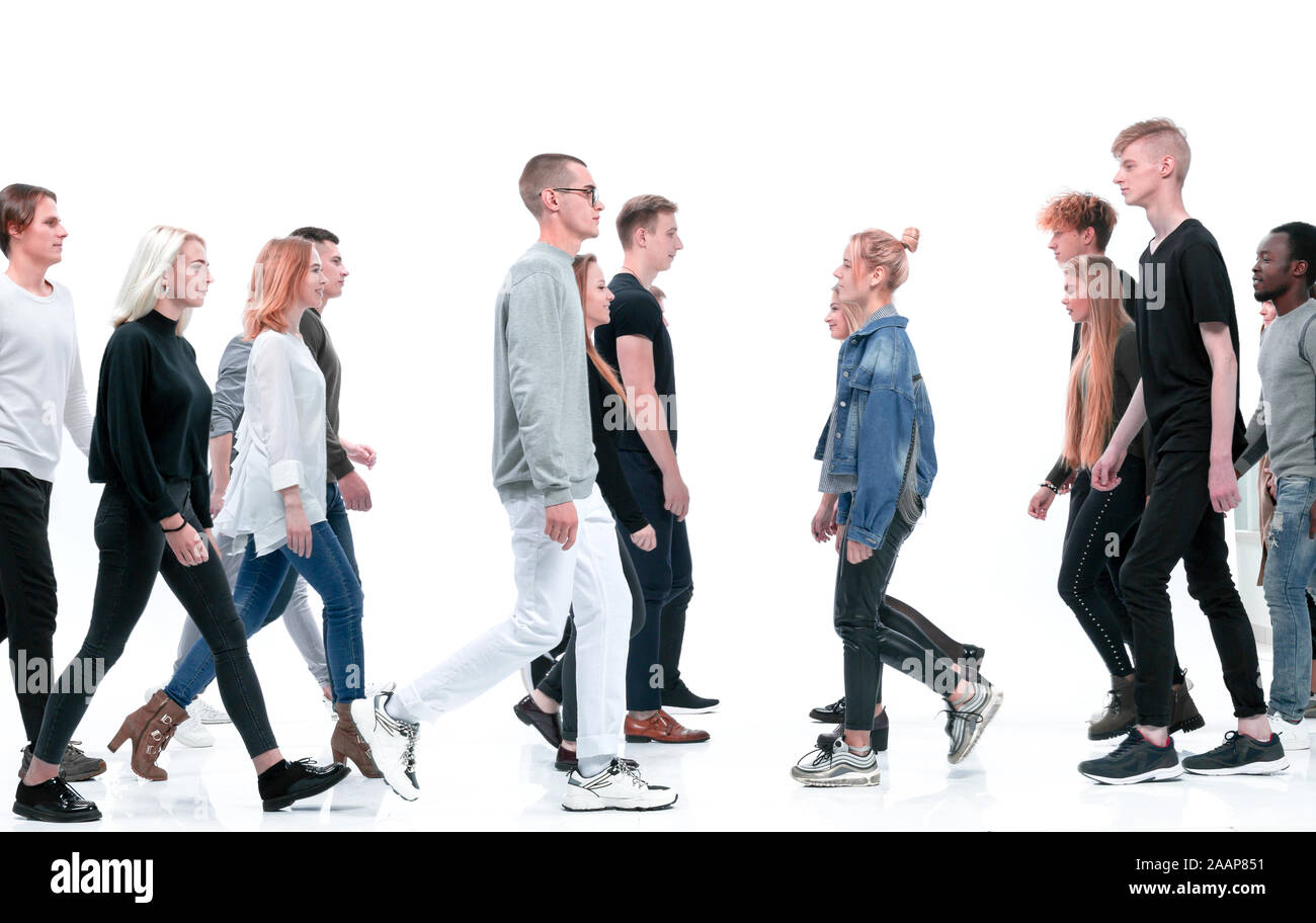 casual young people walking in different directions Stock Photo