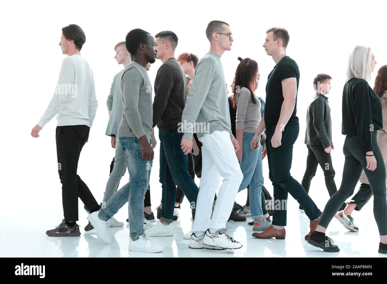 in full growth. diverse young people walk past each other Stock Photo Alamy