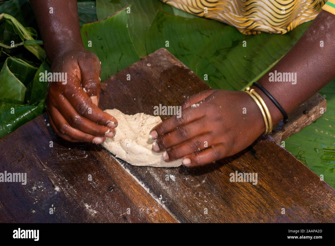 Ethiopia, Rift Valley, Gamo Gofo Omo, Arba Minch, Dorze village, woman’s hand preparing cojo banana bread Stock Photo