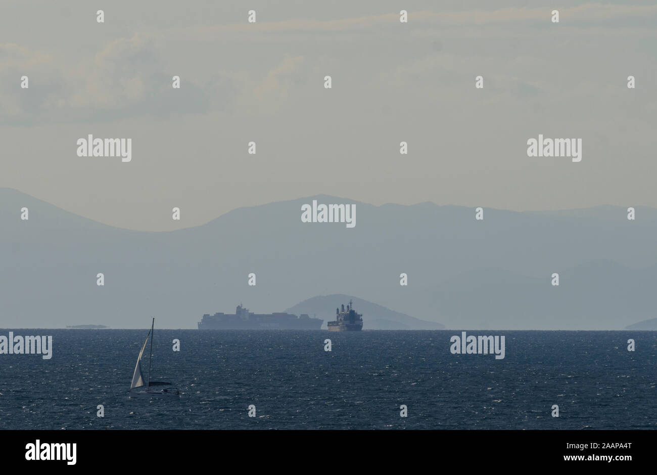 Cargo ships entering the Port of Piraeus in Athens Greece Stock Photo
