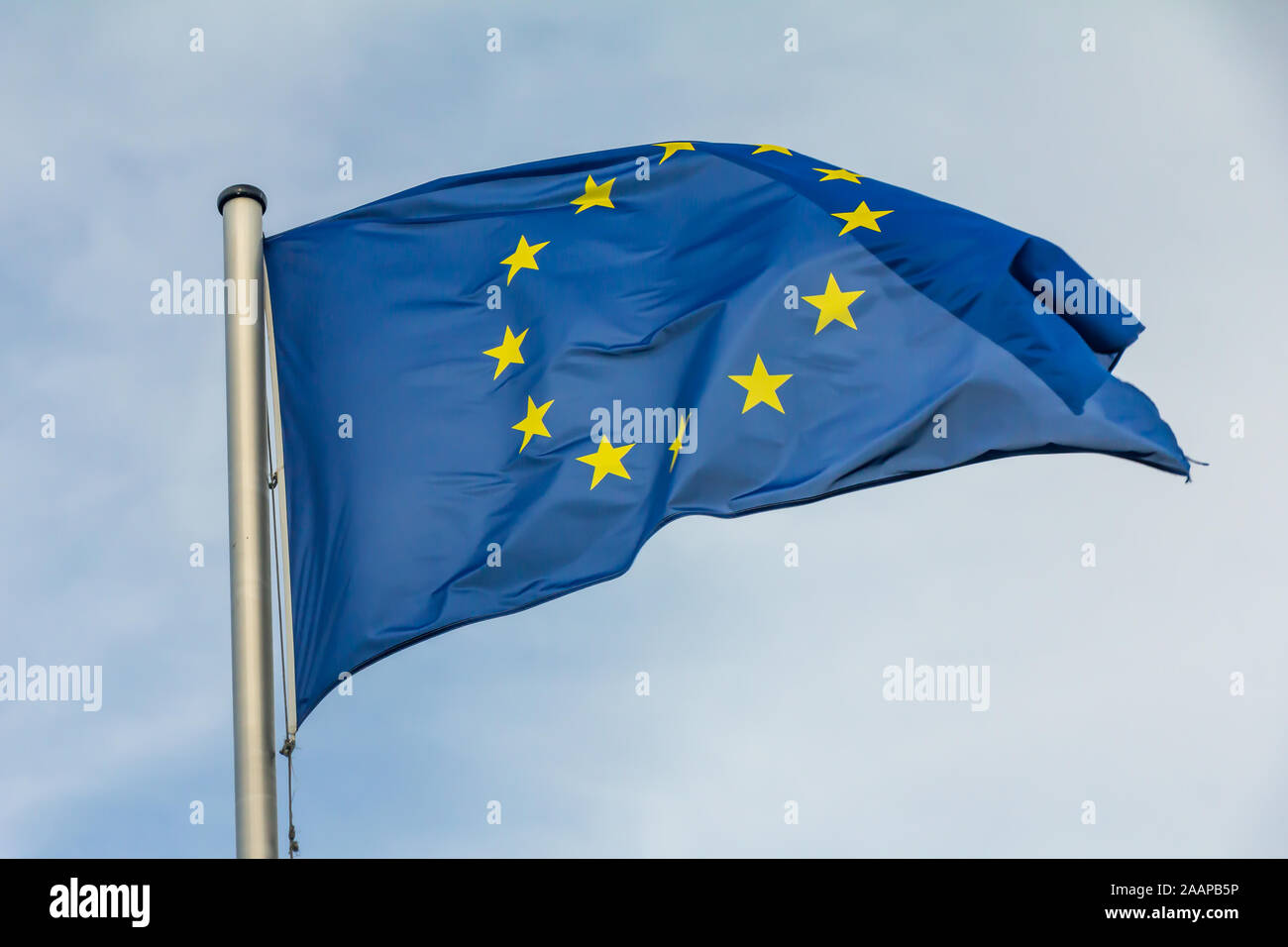 EU, Europe, European Union flag waving on blue sky background Stock Photo