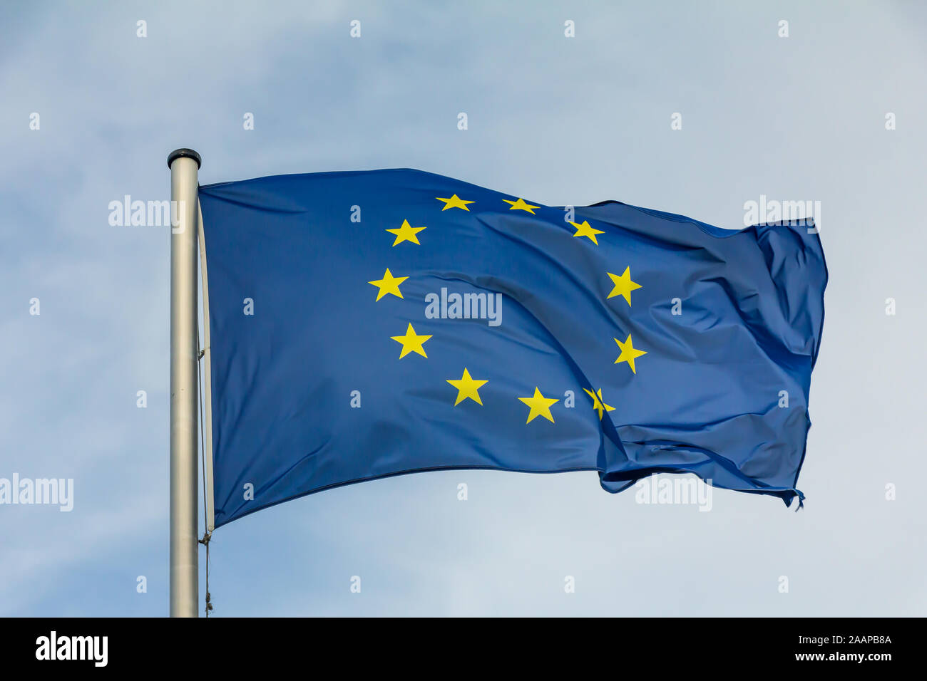 EU, Europe, European Union flag waving on blue sky background Stock ...