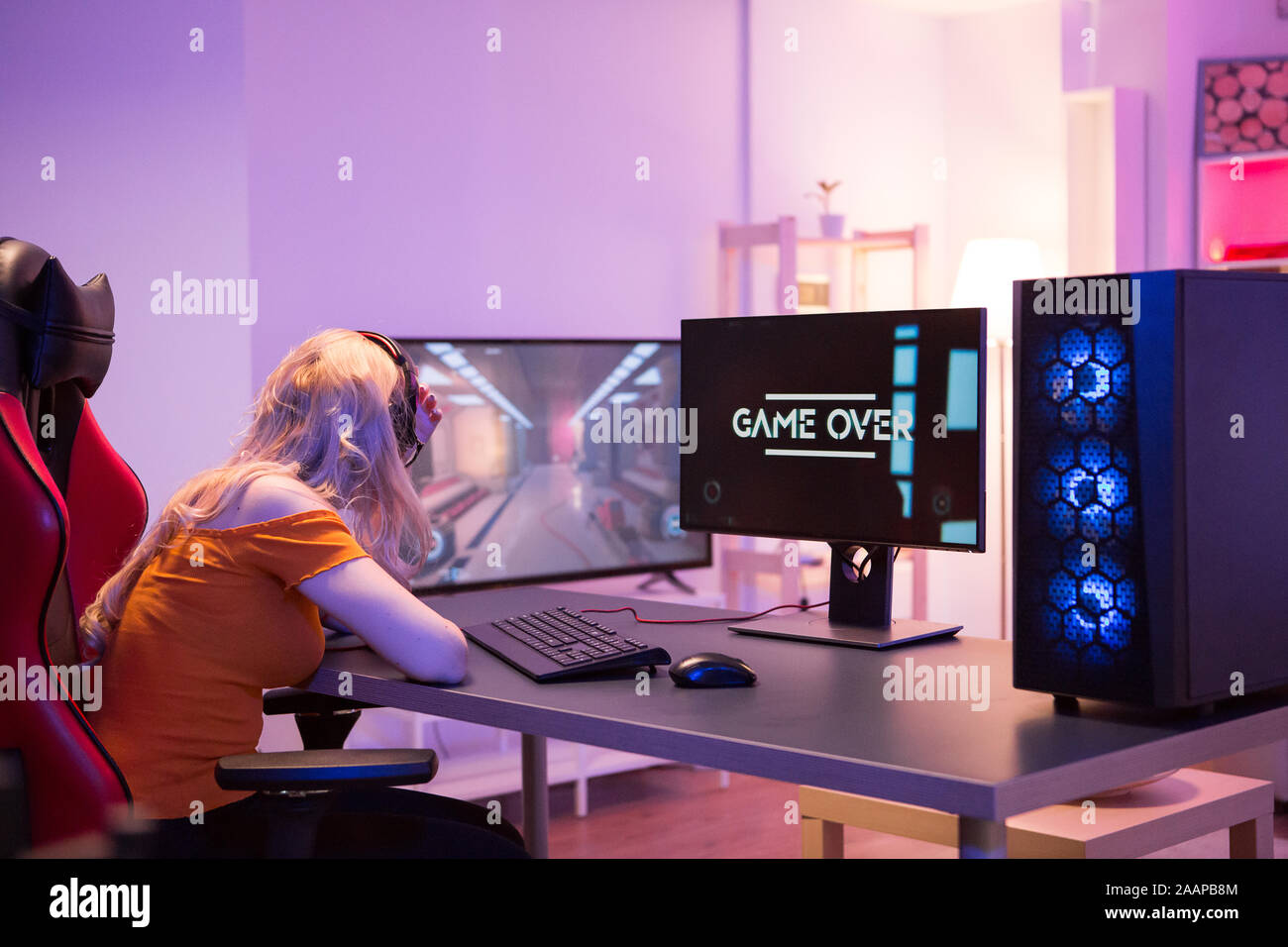 Game Over Computer Gaming Sad girl because she lost while playing online games on computer. Girl ...