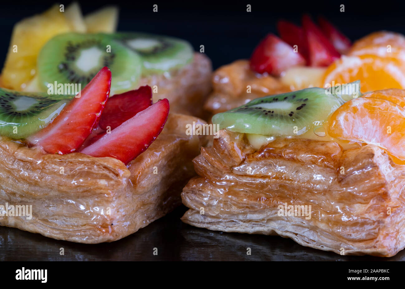 Delicious puff pastry with cream and fruits Stock Photo