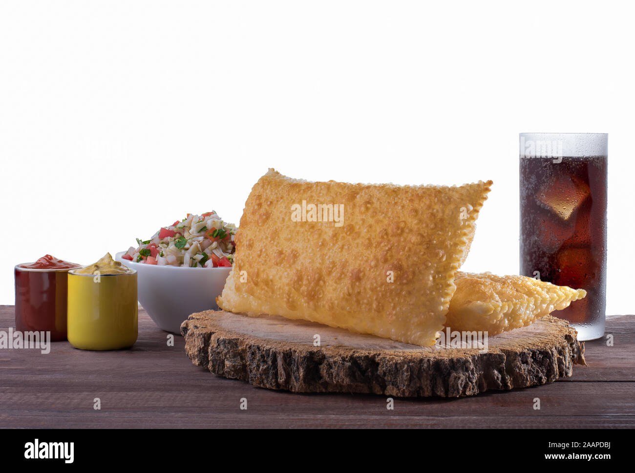 Traditional Brazilian pastry (pastel) with vinaigrette and soda Stock