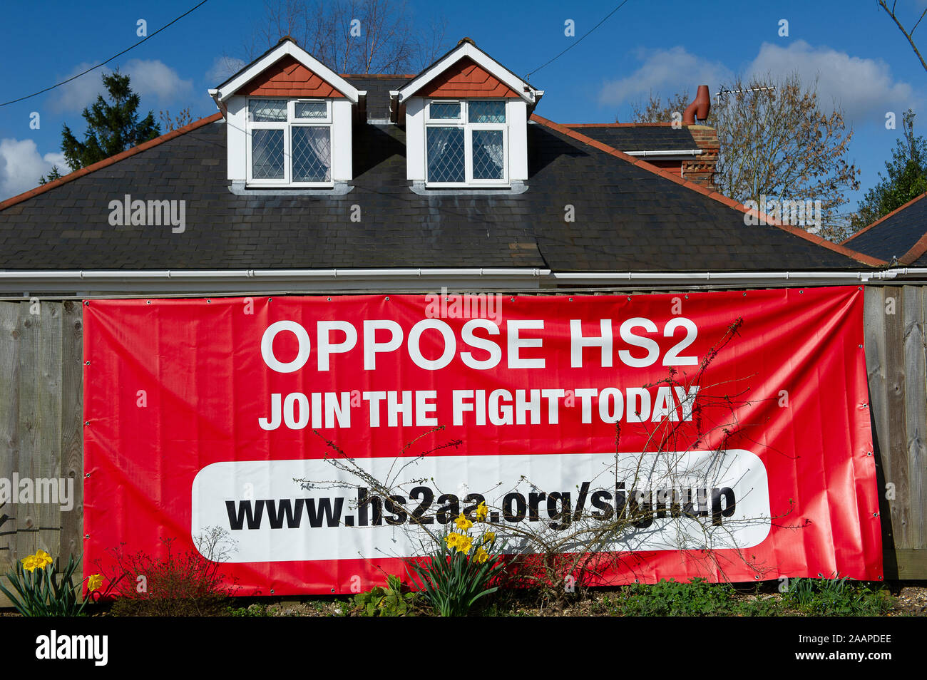 HS2 oppostion sign by A413 road near Little Missenden, Buckinghamshire, UK. 21st March, 2014. A number of large HS2 opposition signs have been placed in fields and outside homes in the county of Buckinghamshire. Many local residents are opposed to the planned HS2 High Speed Rail link from London to Birmingham as it expected to result in the destruction of countryside, rural habitats and ancient woodlands. Credit: Maureen McLean/Alamy Stock Photo