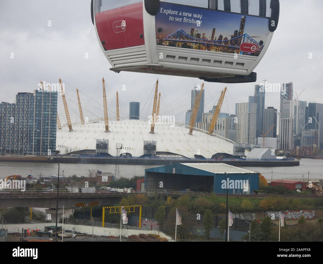 An Emirates Air Line cable car suspended above the O2 arena whilst ...