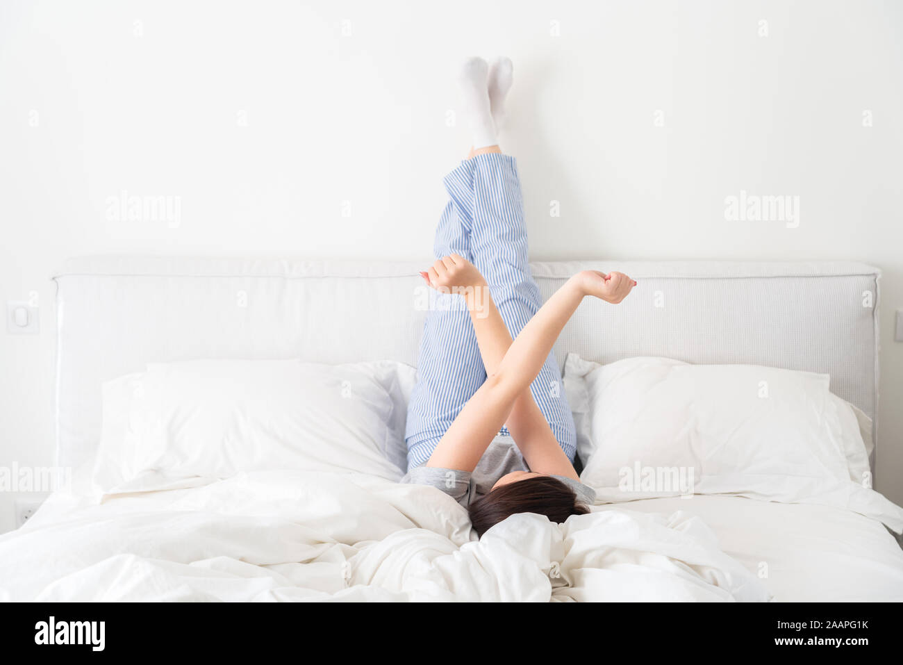 Woman with pillow under legs hires stock photography and images Alamy
