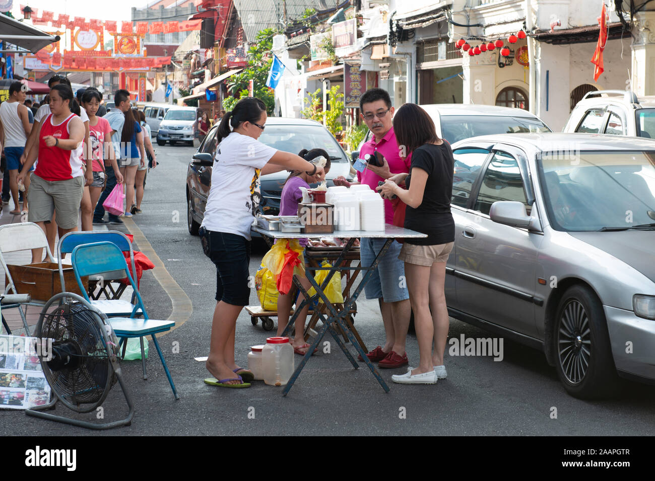 Local people preparing street food for the weekend night-market in Malacca, Malaysia Stock Photo