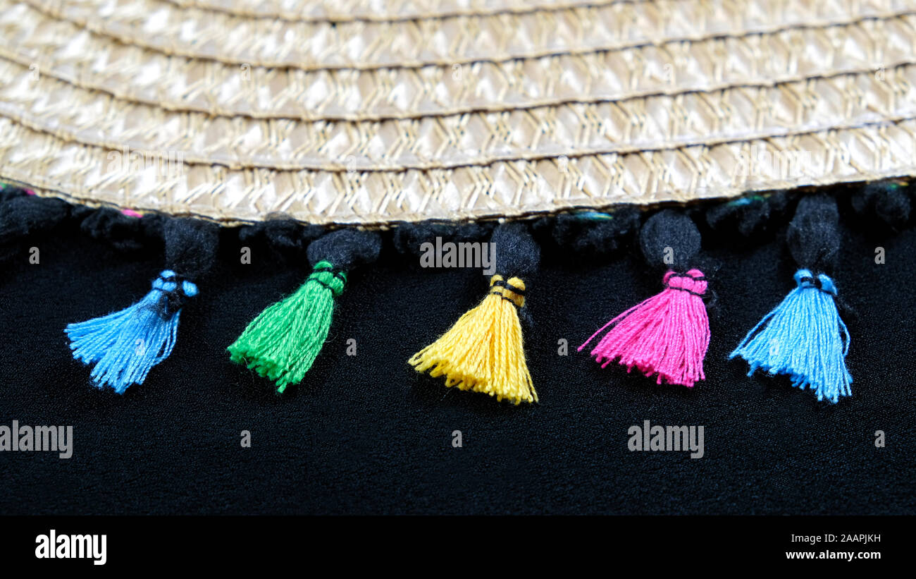 Colorful tassels on black background Stock Photo