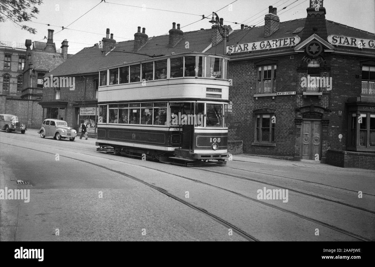 Sheffield Standard Tram no 108 on route to Intake. Image taken outside the Star and Garter Hotel and Pub on Winter Street, Sheffield 3 The Star and Garter has since closed and the area is under redevelopment. Image taken during the 1950s Stock Photo