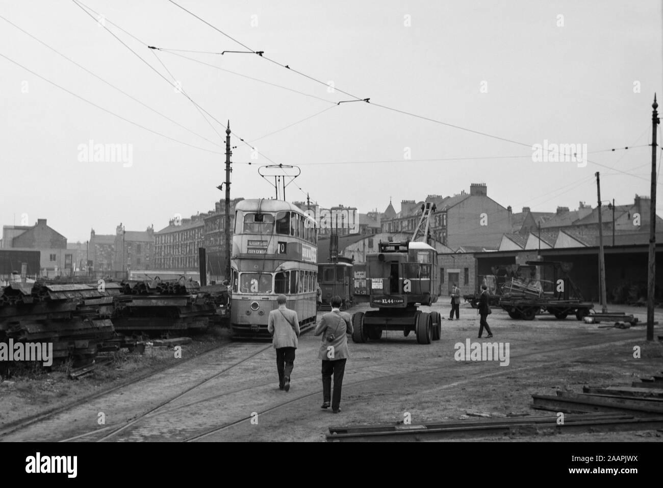 Glasgow Corporation Tramway tram no 1360 near the tram depot. Image taken before the closure of the tramlines which was in 1962 note the photographers that were on the scene to record and preserve the prosperity. Stock Photo