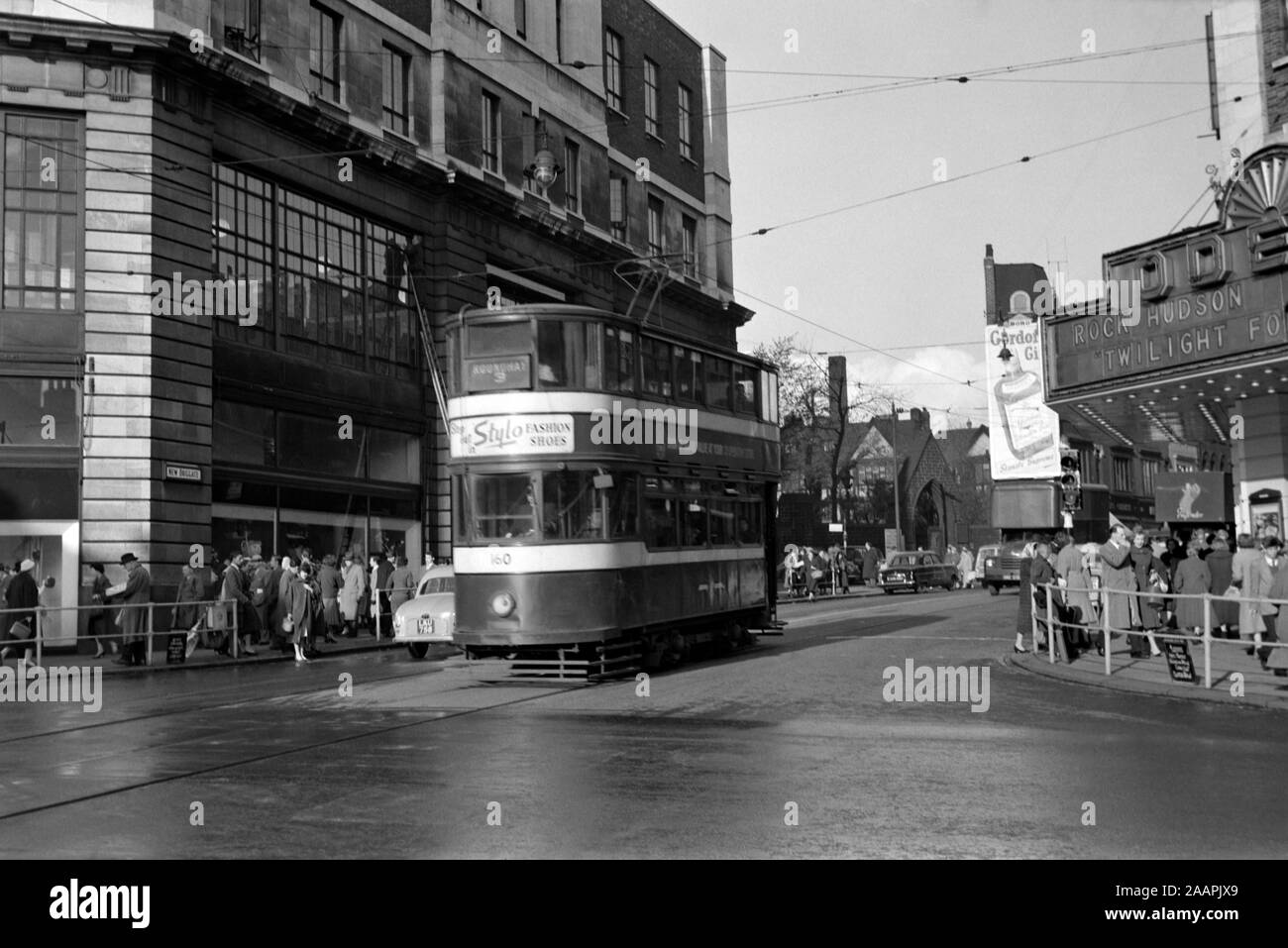 Leeds Standard Tram no 160 outside the Odeon Cinema at New Briggate in 1958 The cinema is showing Twilight for the Gods - staring Rock Hudson. Leeds city has changed somewhat over the years. The Cinema building is still there but is now a Primark store. Stock Photo