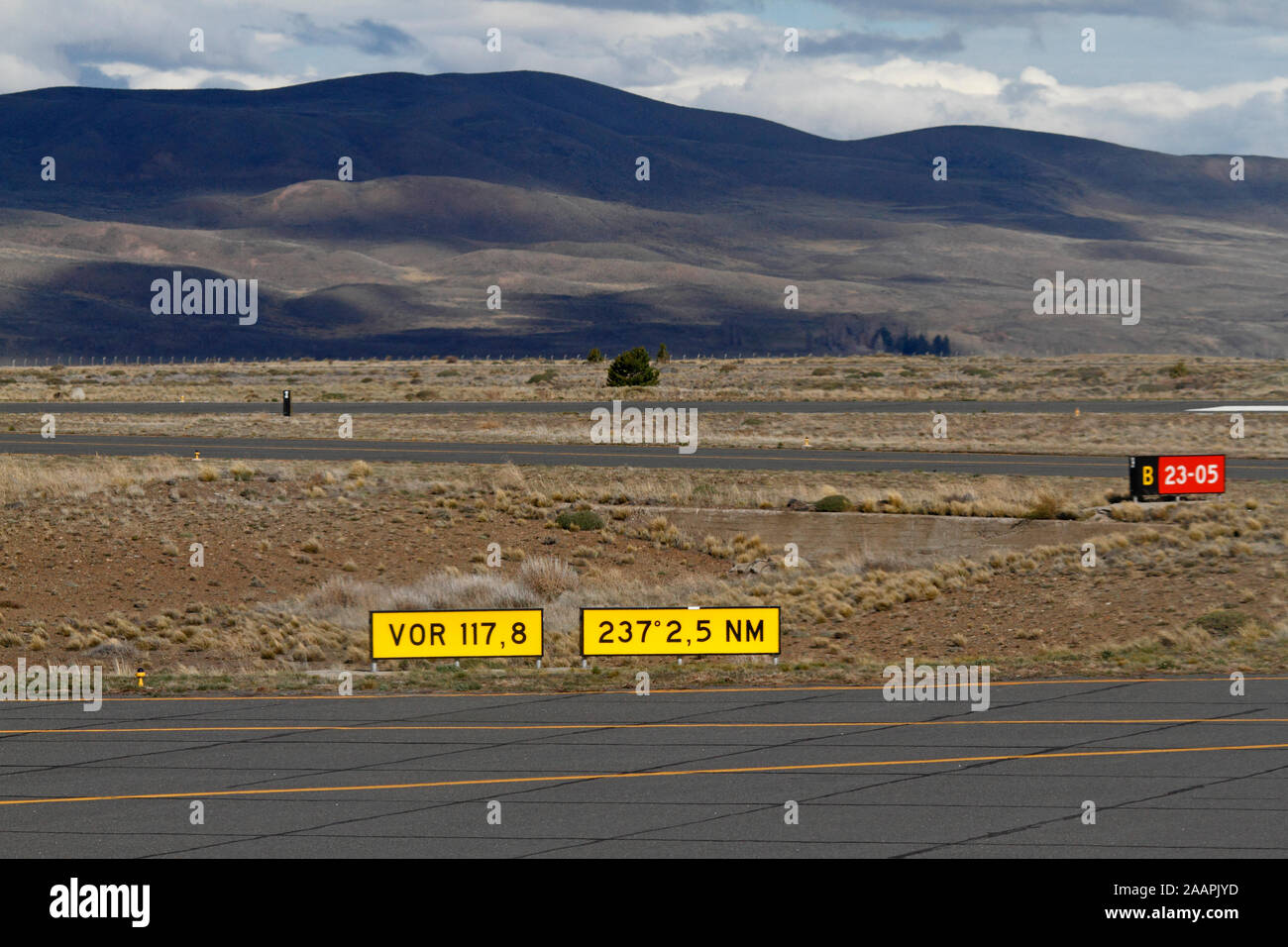 Esquel Airport, Aeropuerto de Esquel. Tarmac and runway. Empty. Mountains backdrop. Stock Photo