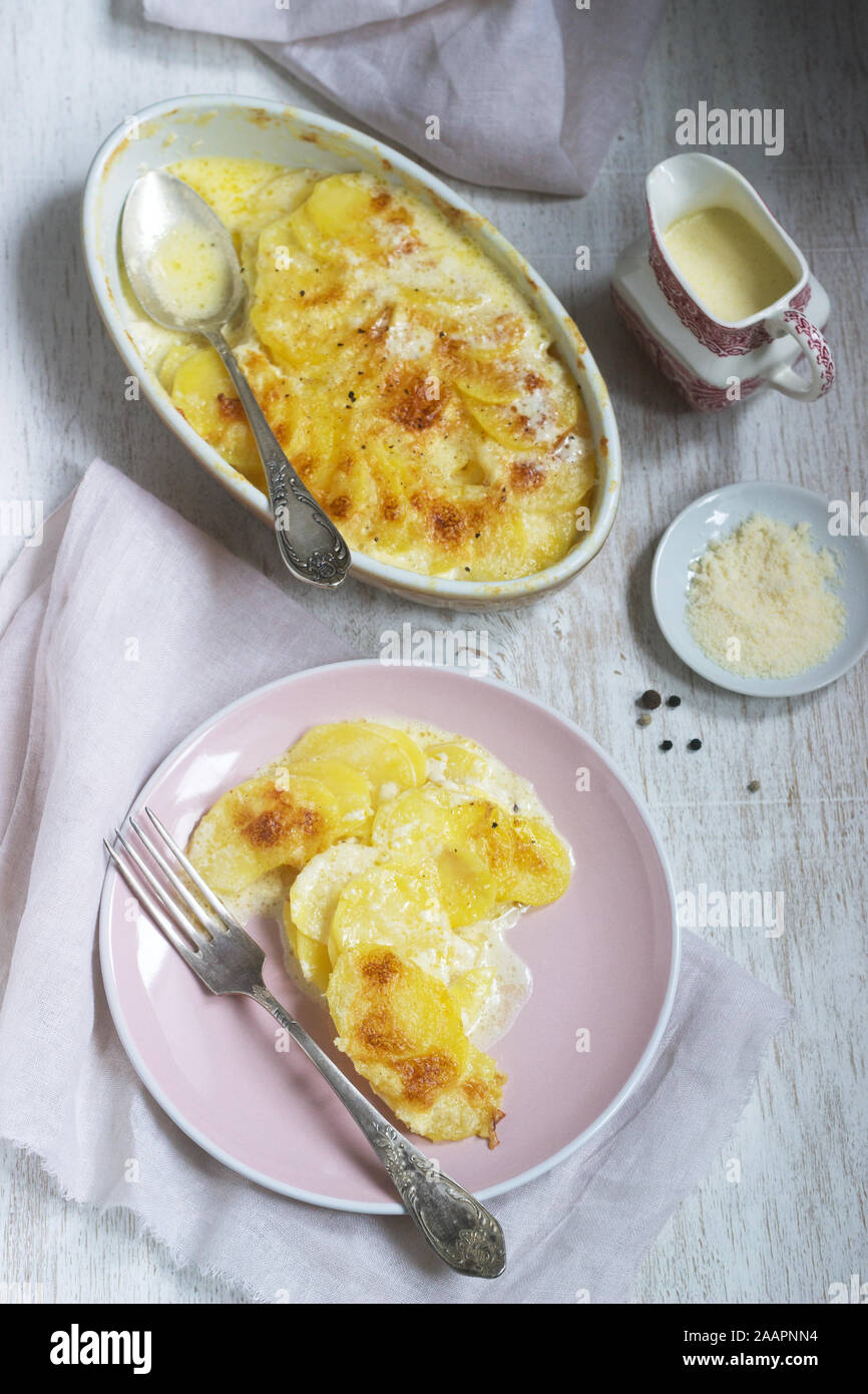 French Dish Gratin Dauphinois In Ceramic Form On A Light