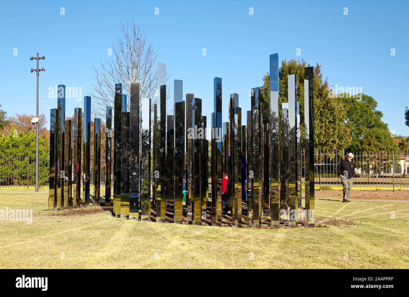 Mirror Labyrinth sculpture; 2017; Jeppe Hein; steel and mirrors; people walking among panels; art; Besthoff Sculpture Gardens; City Park, New Orleans; Stock Photo
