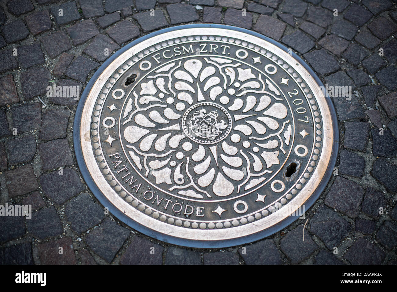 A decorative manhole cover, Budapest, Hungary Stock Photo