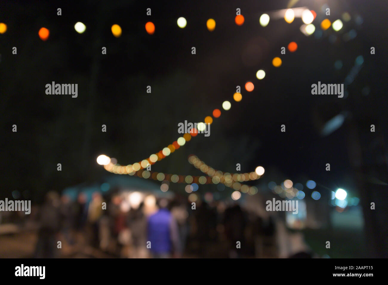 Multi-colored bokeh balls against a dark background Stock Photo