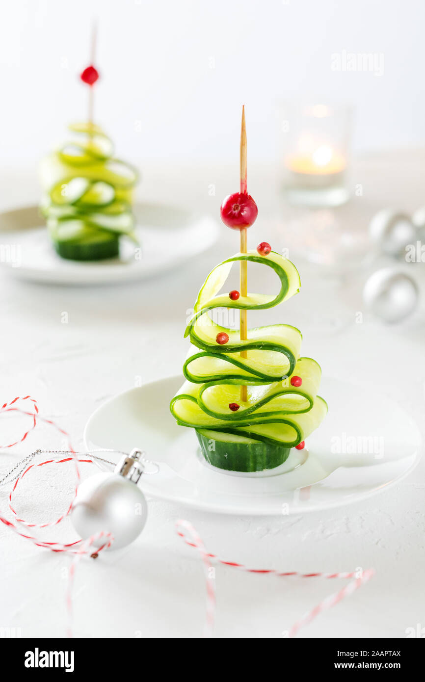 Cucumber Christmas tree, funny food for kids. Christmas food background. Stock Photo